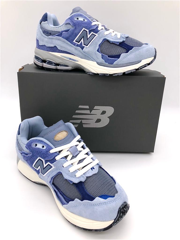 Découvrez les baskets New Balance 2002R Protection Pack - Light Arctic Grey Purple : un style polyvalent pour hommes et femmes.